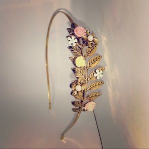 Bands 2 for $10. Gold metal headband with flowers.